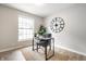 Bright home office features a modern desk and a large window at 3818 Fetlock Dr, Indianapolis, IN 46227