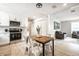 Inviting living space featuring wood floors, modern appliances, and adjoined living room at 3818 Fetlock Dr, Indianapolis, IN 46227