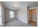 Cozy bedroom with neutral walls, gray carpet and a large window, offering natural light at 418 Eastern Ave, Indianapolis, IN 46201