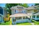 Charming two-story home featuring a covered front porch and well-maintained landscaping at 418 Eastern Ave, Indianapolis, IN 46201