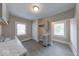 Compact kitchen offers gray cabinets, marble countertops, and natural light at 418 Eastern Ave, Indianapolis, IN 46201