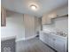 Efficient kitchen design with gray cabinets, ample counter space, and new fixtures at 418 Eastern Ave, Indianapolis, IN 46201