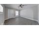 Inviting room with neutral walls, modern gray flooring, natural light, and a ceiling fan at 418 Eastern Ave, Indianapolis, IN 46201