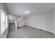 Inviting living room features gray flooring, staircase, and windows with natural light at 418 Eastern Ave, Indianapolis, IN 46201