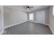 This grey, minimalist living room is well-lit and inviting with neutral colored walls at 418 Eastern Ave, Indianapolis, IN 46201