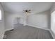 Bright living room with neutral walls, grey flooring and a ceiling fan for a modern touch at 418 Eastern Ave, Indianapolis, IN 46201