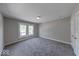 Bedroom featuring neutral walls, new carpet, and natural light from the window at 420 Eastern Ave, Indianapolis, IN 46201