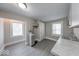 Charming kitchen boasts gray cabinets, vinyl flooring, and stainless steel sink at 420 Eastern Ave, Indianapolis, IN 46201