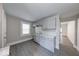 Charming kitchen boasts gray cabinets, vinyl flooring, and stainless steel sink at 420 Eastern Ave, Indianapolis, IN 46201