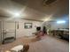 Basement featuring carpet, storage, and window at 4363 Roosevelt Dr, Columbus, IN 47201