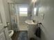 Bathroom featuring modern fixtures, including shower, sink, and toilet at 4363 Roosevelt Dr, Columbus, IN 47201