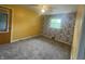 Bedroom features neutral carpet, a ceiling fan, and lots of natural light at 4363 Roosevelt Dr, Columbus, IN 47201