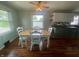 Well-lit dining area showcasing hardwood floors, natural light, and comfortable seating at 4363 Roosevelt Dr, Columbus, IN 47201