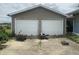 Exterior view of garage with concrete driveway at 4363 Roosevelt Dr, Columbus, IN 47201
