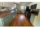 Functional kitchen featuring updated appliances, tile backsplash, and ample counter space at 4363 Roosevelt Dr, Columbus, IN 47201