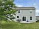 A home with an expansive backyard, complete with a patio area and lush green lawn at 4925 Chip Shot Ln, Indianapolis, IN 46235