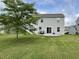 Home featuring a spacious backyard and patio area, ideal for outdoor gatherings at 4925 Chip Shot Ln, Indianapolis, IN 46235