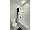 Full bath featuring a shower-tub combination and white tile at 4925 Chip Shot Ln, Indianapolis, IN 46235