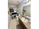 Cozy bathroom featuring a combination shower and bathtub, vanity with mirror, and toilet at 4925 Chip Shot Ln, Indianapolis, IN 46235