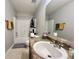 Cozy bathroom with a single sink vanity, and a shower-tub with a shower curtain at 4925 Chip Shot Ln, Indianapolis, IN 46235