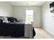 Comfortable bedroom featuring a neutral color palette and a cozy black bed at 4925 Chip Shot Ln, Indianapolis, IN 46235