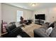 Cozy bedroom with comfortable seating area and large television, perfect for relaxing or entertaining at 4925 Chip Shot Ln, Indianapolis, IN 46235