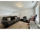 Bonus room features grey couch, desk and a make up station at 4925 Chip Shot Ln, Indianapolis, IN 46235