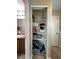 Organized closet featuring multiple storage shelves for linen and various household items at 4925 Chip Shot Ln, Indianapolis, IN 46235