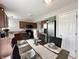 Cozy dining area featuring a modern table setting, contemporary decor, and stainless steel appliances at 4925 Chip Shot Ln, Indianapolis, IN 46235