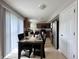 Dining area with an adjacent modern kitchen featuring stainless steel appliances and ample natural light at 4925 Chip Shot Ln, Indianapolis, IN 46235