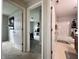 Hallway with doors open leading to a bathroom and bedroom at 4925 Chip Shot Ln, Indianapolis, IN 46235