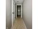 Neutral hallway with tile flooring at 4925 Chip Shot Ln, Indianapolis, IN 46235