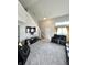 Bright and spacious living room featuring tall ceilings, neutral paint, and plush carpeting at 4925 Chip Shot Ln, Indianapolis, IN 46235