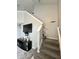 View of stairway and living room with media center at 4925 Chip Shot Ln, Indianapolis, IN 46235