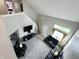 Spacious living room with vaulted ceilings, stylish black leather seating, and plenty of natural light at 4925 Chip Shot Ln, Indianapolis, IN 46235