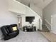 Spacious living room with high ceilings, a leather recliner, and a modern TV setup at 4925 Chip Shot Ln, Indianapolis, IN 46235