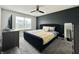 This main bedroom boasts a plush bed, modern dresser, and a calming gray color palette at 4925 Chip Shot Ln, Indianapolis, IN 46235