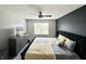 This main bedroom features a plush bed, sleek dresser, and a calming gray color palette at 4925 Chip Shot Ln, Indianapolis, IN 46235