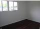 Sunlit bedroom with hardwood floors and a bright window at 5 Tousley Ct, Indianapolis, IN 46224