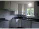 Functional kitchen with white cabinets and modern fixtures at 5 Tousley Ct, Indianapolis, IN 46224