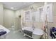 Classic bathroom featuring a clawfoot tub, stained glass windows, and neutral wall color at 552 Woodruff Pl W Dr, Indianapolis, IN 46201