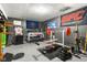 Finished basement features a weight training area and seating at the bar at 5631 N Peppereel Way, McCordsville, IN 46055