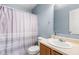 This is a bathroom with a single sink, toilet, and shower with a shower curtain at 5631 N Peppereel Way, McCordsville, IN 46055