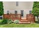 Wooden deck off the back of the home, featuring a table and seating at 5631 N Peppereel Way, McCordsville, IN 46055