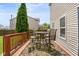 Wooden deck off the back of the house features a seating area with a table and chairs at 5631 N Peppereel Way, McCordsville, IN 46055