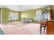 Vintage style living room with lots of light, including stylish sofa, carpet and furniture at 5631 N Peppereel Way, McCordsville, IN 46055