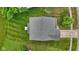 Aerial view of a well maintained house with nice roof and a big yard at 5637 Woodland Trace Blvd, Indianapolis, IN 46237