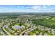 Beautiful aerial view of a neighborhood featuring well-maintained homes and a tranquil pond at 5637 Woodland Trace Blvd, Indianapolis, IN 46237