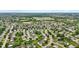 Expansive aerial view of a suburban community with lush green spaces and winding streets at 5637 Woodland Trace Blvd, Indianapolis, IN 46237