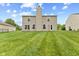 The property showcases a well-kept backyard, ideal for entertaining, with its level lawn and clean exterior lines at 5637 Woodland Trace Blvd, Indianapolis, IN 46237